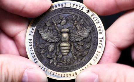 Aurora Lite Application in Brass Coins: Intricate 3D Embossing