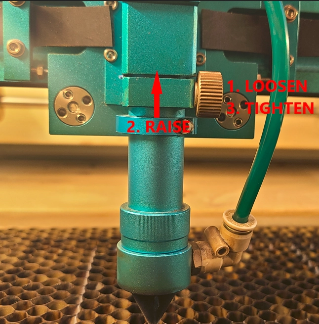 Adjusting the Nova laser head for manual focus